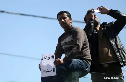 Palestinian teachers take part in a protest to demand their rights in front of the headquarters of the Council of Ministers, in the West bank city of Ramallah, March7, 2016. Photo by Shadi Hatem