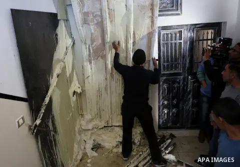 Palestinians check the damage house of Ibrahim Skafi that was demolished by the Israeli army in the West Bank city of Hebron March 8, 2016. Skafi was shot dead after he rammed an Israeli soldiers in Halhul north of Hebro...