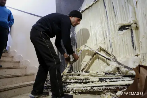 Palestinians check the damage house of Ibrahim Skafi that was demolished by the Israeli army in the West Bank city of Hebron March 8, 2016. Skafi was shot dead after he rammed an Israeli soldiers in Halhul north of Hebro...