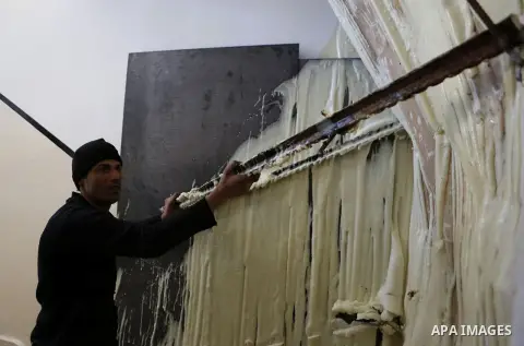 Palestinians check the damage house of Ibrahim Skafi that was demolished by the Israeli army in the West Bank city of Hebron March 8, 2016. Skafi was shot dead after he rammed an Israeli soldiers in Halhul north of Hebro...