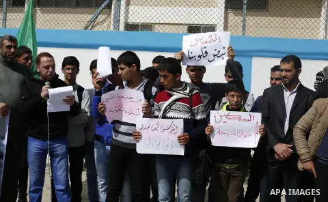 Palestinians take part during a protest to show solidarity with Al-Aqsa mosque and Palestinians in the West Bank occupied, in khan Younis in the southern Gaza strip on March 9, 2016. Photo by Ramadan El-agha