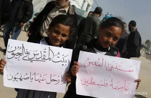 Palestinians take part during a protest to show solidarity with Al-Aqsa mosque and Palestinians in the West Bank occupied, in khan Younis in the southern Gaza strip on March 9, 2016. Photo by Ramadan El-agha