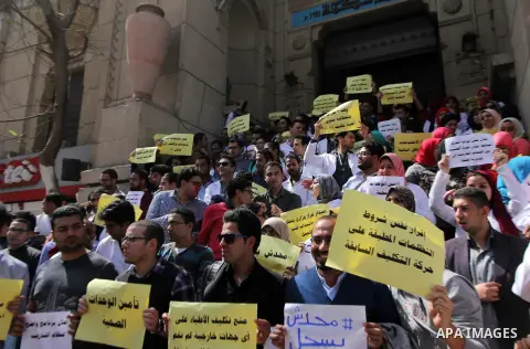Egyptian Doctors take part in a protest to demanding their rights, in Cairo, Egypt, on March 9, 2016. Photo by Amr Sayed