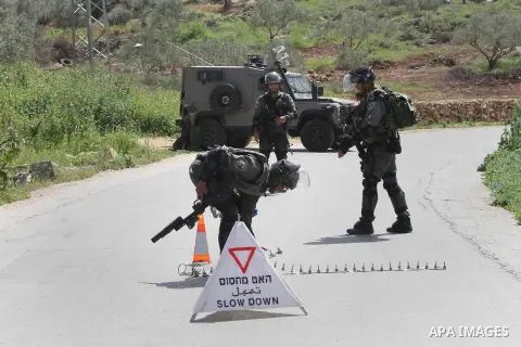 Israeli police gather at the scene of a stabbing attack in the West Bank village of Salfit, 09 March 2016. Israeli forces shot dead a 16-year-old Palestinian boy after he attempted to carry out a stabbing attack at a mil...