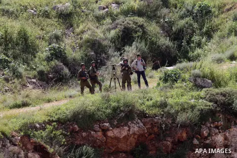 Israeli police gather at the scene of a stabbing attack in the West Bank village of Salfit, 09 March 2016. Israeli forces shot dead a 16-year-old Palestinian boy after he attempted to carry out a stabbing attack at a mil...