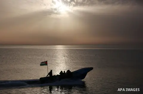 Palestininas ride a boat in the Mediterranean sea on the coast of Gaza city, on March 09, 2016. Photo by Yasser Qudih