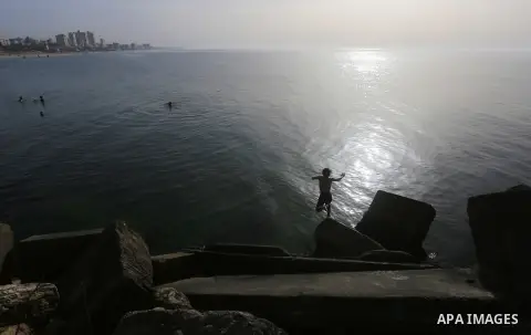 Palestininas swim in the Mediterranean sea on the coast of Gaza city, on March 09, 2016. Photo by Yasser Qudih