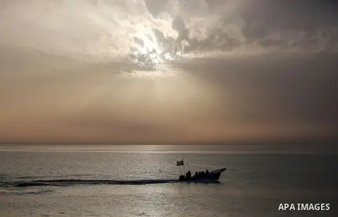Palestininas ride a boat in the Mediterranean sea on the coast of Gaza city, on March 09, 2016. Photo by Yasser Qudih