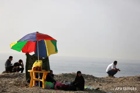 Palestinians enjoy a day at the beach of the Mediterranean sea on the coast of Gaza city, on March 09, 2016. Photo by Yasser Qudih