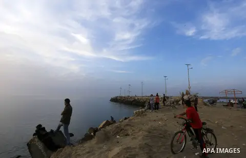 Palestinians enjoy a day at the beach of the Mediterranean sea on the coast of Gaza city, on March 09, 2016. Photo by Yasser Qudih