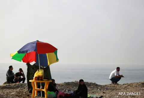 Palestinians enjoy a day at the beach of the Mediterranean sea on the coast of Gaza city, on March 09, 2016. Photo by Yasser Qudih