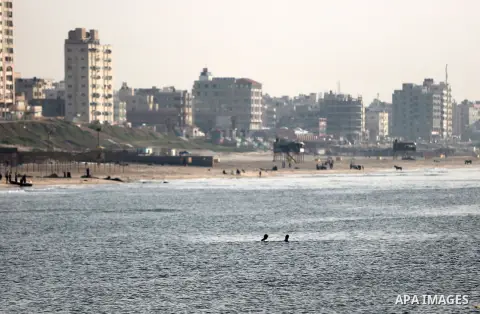 Palestininas swim in the Mediterranean sea on the coast of Gaza city, on March 09, 2016. Photo by Yasser Qudih