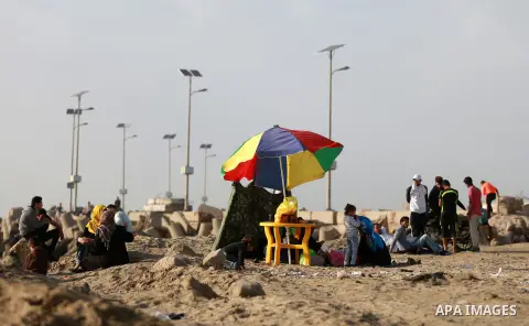 Palestinians enjoy a day at the beach of the Mediterranean sea on the coast of Gaza city, on March 09, 2016. Photo by Yasser Qudih
