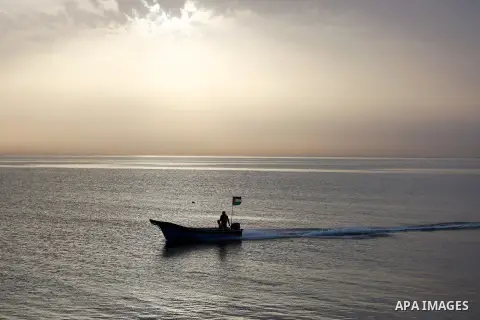 Palestininas ride a boat in the Mediterranean sea on the coast of Gaza city, on March 09, 2016. Photo by Yasser Qudih