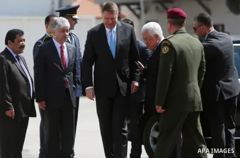 Romanian President Klaus Iohannis reviews honor guard with Palestinian president Mahmoud Abbas upon his arrival to the West Bank city of Ramallah on March 10, 2016. Photo by Shadi Hatem