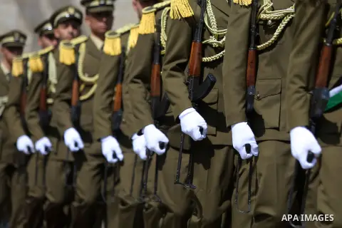 Palestinian honor guards during a welcome ceremony for Romanian President Klaus Iohannis at the Muqata, the Palestinian Presidential Headquarters upon his arrival to the West Bank city of Ramallah on March 10, 2016. Phot...