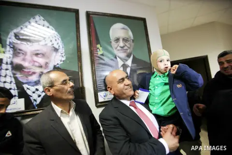 Five-year-old Ahmed Dawabsha, a Palestinian boy who survived a firebombing by Jewish extremists targeting his family home that killed his parents and brother, meets with the governor of the northern Palestinian town of N...