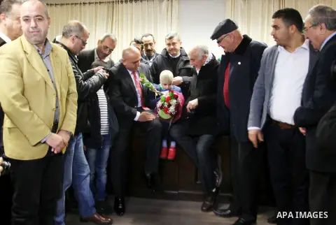 Five-year-old Ahmed Dawabsha, a Palestinian boy who survived a firebombing by Jewish extremists targeting his family home that killed his parents and brother, meets with the governor of the northern Palestinian town of N...
