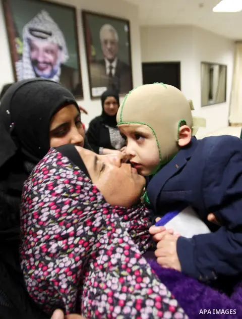 Five-year-old Ahmed Dawabsha, a Palestinian boy who survived a firebombing by Jewish extremists targeting his family home that killed his parents and brother, is seen before his meeting with the governor of the northern...