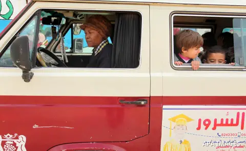 Salwa Sorour drives her mini-van in Gaza City on March 16, 2016. 40-year-old Salwa Sorour is the only woman who drives a kindergarten mini-van to transport children in the Gaza Strip. The Palestinian Central Bureau of St...