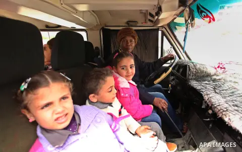 Salwa Sorour drives her mini-van in Gaza City on March 16, 2016. 40-year-old Salwa Sorour is the only woman who drives a kindergarten mini-van to transport children in the Gaza Strip. The Palestinian Central Bureau of St...