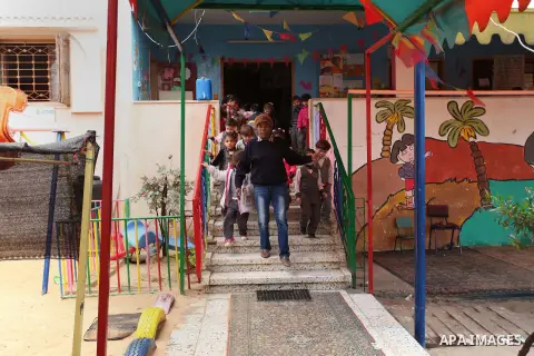 Salwa Sorour plays with children inside a kindergarten in Gaza City, on March 16, 2016. 40-year-old Salwa Sorour is the only woman who drives a kindergarten mini-van to transport children in the Gaza Strip. The Palestini...