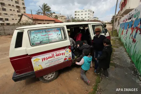 Salwa Sorour drives her mini-van in Gaza City on March 16, 2016. 40-year-old Salwa Sorour is the only woman who drives a kindergarten mini-van to transport children in the Gaza Strip. The Palestinian Central Bureau of St...