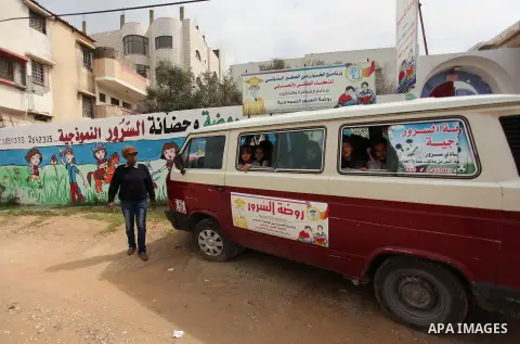Salwa Sorour drives her mini-van in Gaza City on March 16, 2016. 40-year-old Salwa Sorour is the only woman who drives a kindergarten mini-van to transport children in the Gaza Strip. The Palestinian Central Bureau of St...