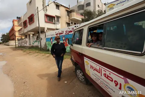 Salwa Sorour drives her mini-van in Gaza City on March 16, 2016. 40-year-old Salwa Sorour is the only woman who drives a kindergarten mini-van to transport children in the Gaza Strip. The Palestinian Central Bureau of St...