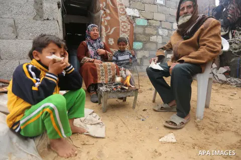 Palestinian woman Jihan Abu Muhsen makes tea before going to work collecting bricks for sale from the sites of demolished buildings, at her dwelling in Khan Younis in the southern Gaza Strip March 17, 2016. Abu Muhsen ga...