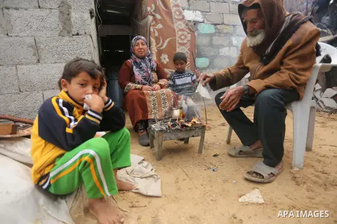 Palestinian woman Jihan Abu Muhsen makes tea before going to work collecting bricks for sale from the sites of demolished buildings, at her dwelling in Khan Younis in the southern Gaza Strip March 17, 2016. Abu Muhsen ga...
