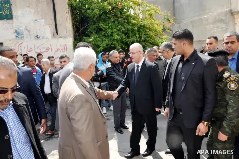Palestinian Prime Minister Rami Hamdallah attends the funeral of 16 Palestinians, who lost their lives in overturned bus accident in Jordan on their way to Saudi Arabia for umrah in the West Bank village of Deir al-Ghoss...
