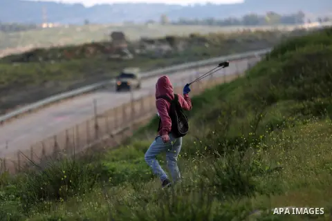 Palestinian protesters clash with Israeli security forces on March 18, 2016, following a demonstration in solidarity with Palestinian prisoners held in Israeli jails, outside the compound of the Israeli-run Ofer prison n...