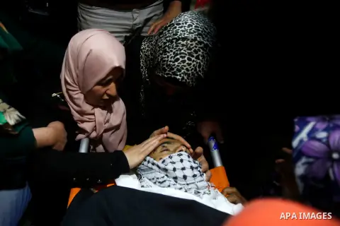 Mother of 19 years old Mahmoud Abu Fanoneh mourns over his body during his funeral in the West Bank city of Hebron, 19 March 2016. Mahmoud who according to the Israeli Army attempted to kill an Israeli soldier at a main...