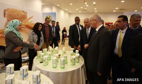 Palestinian Prime Minister Rami Hamdallah attends the opening of Palestinian food exhibition in the West Bank city of Ramallah on March 20, 2016. Photo by Prime Minister Office