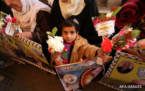 Palestinian women take part in a protest demanding release the prisoners in Israeli jails, in front of Red cross office, in Gaza city, on March 21, 2016. Photo by Ashraf Amra