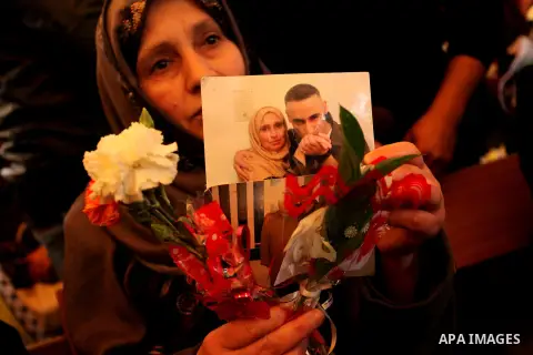 Palestinian women take part in a protest demanding release the prisoners in Israeli jails, in front of Red cross office, in Gaza city, on March 21, 2016. Photo by Ashraf Amra
