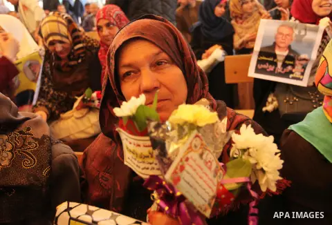 Palestinian women take part in a protest demanding release the prisoners in Israeli jails, in front of Red cross office, in Gaza city, on March 21, 2016. Photo by Ashraf Amra