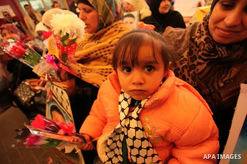 Palestinian women take part in a protest demanding release the prisoners in Israeli jails, in front of Red cross office, in Gaza city, on March 21, 2016. Photo by Ashraf Amra