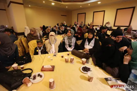 Palestinians attend a ceremony Book sinning for Hamas founder the martyr, Ahmed Yaseen in 12th anniversary for his assassination in Gaza City on March 22, 2016. Photo by Ashraf Amra