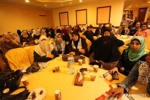 Palestinians attend a ceremony Book sinning for Hamas founder the martyr, Ahmed Yaseen in 12th anniversary for his assassination in Gaza City on March 22, 2016. Photo by Ashraf Amra