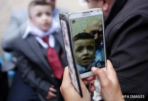 Palestinian boy Ahmed Dawabsha, 5, who suffered severe burns in an arson attack by suspected Jewish attackers on his family home last July and in which his younger brother, Ali, and his parents both died, is welcomed by...