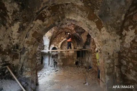A Palestinian worker renovates the archaeological Maqam Al-Khader, in Deir al-Balah, central Gaza on March 24, 2016. Maqam Al-Kader is one of the monuments of the city of Deir al-Balah, the Ministry of Tourism and Antiqu...