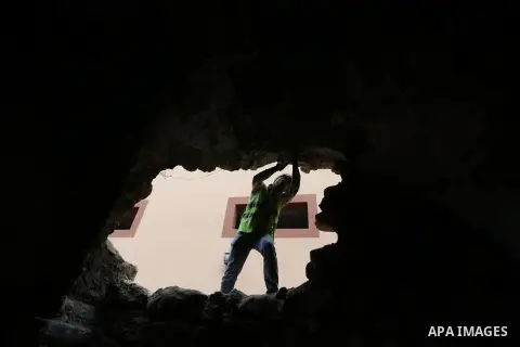 A Palestinian worker renovates the archaeological Maqam Al-Khader, in Deir al-Balah, central Gaza on March 24, 2016. Maqam Al-Kader is one of the monuments of the city of Deir al-Balah, the Ministry of Tourism and Antiqu...