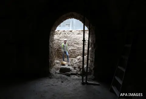 A Palestinian worker renovates the archaeological Maqam Al-Khader, in Deir al-Balah, central Gaza on March 24, 2016. Maqam Al-Kader is one of the monuments of the city of Deir al-Balah, the Ministry of Tourism and Antiqu...