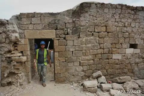 A Palestinian worker renovates the archaeological Maqam Al-Khader, in Deir al-Balah, central Gaza on March 24, 2016. Maqam Al-Kader is one of the monuments of the city of Deir al-Balah, the Ministry of Tourism and Antiqu...