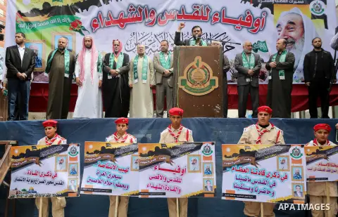 Mushir Al Masri, a Hamas MP and media spokesman speaks during a rally to mark the 12th anniversary of the death of assassinated Hamas spiritual leader Sheikh Ahmed Yassine and show solidarity with Palestinians in Jerusal...