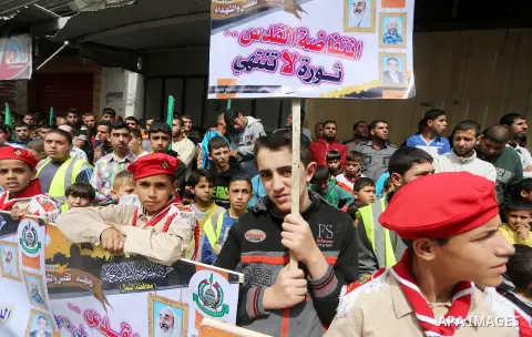Palestinian supporters of Hamas movement take part during a rally to mark the 12th anniversary of the death of assassinated Hamas spiritual leader Sheikh Ahmed Yassine and show solidarity with Palestinians in Jerusalem a...