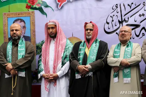 Palestinian supporters of Hamas movement take part during a rally to mark the 12th anniversary of the death of assassinated Hamas spiritual leader Sheikh Ahmed Yassine and show solidarity with Palestinians in Jerusalem a...