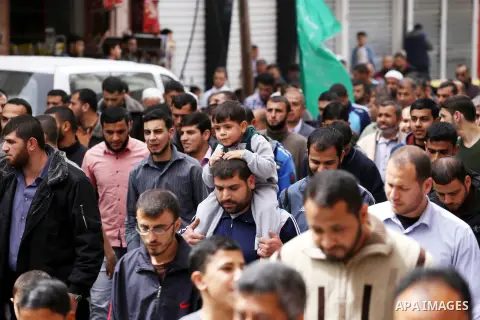 Palestinian supporters of Hamas movement take part during a rally to mark the 12th anniversary of the death of assassinated Hamas spiritual leader Sheikh Ahmed Yassine and show solidarity with Palestinians in Jerusalem a...